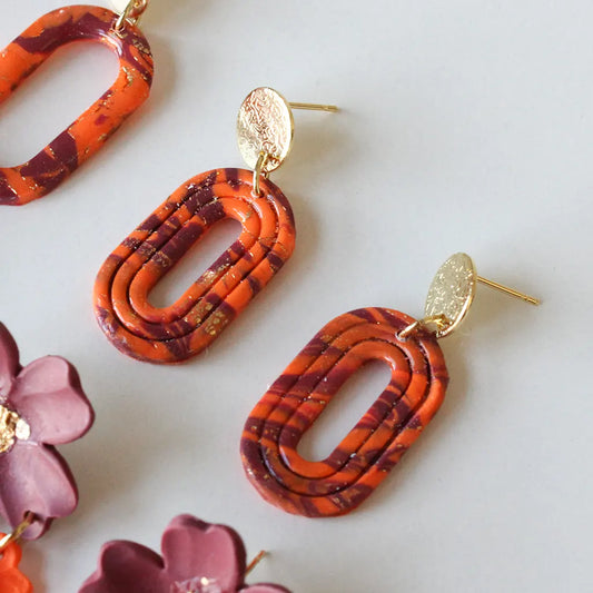 Aura líneas estampado naranja y morado