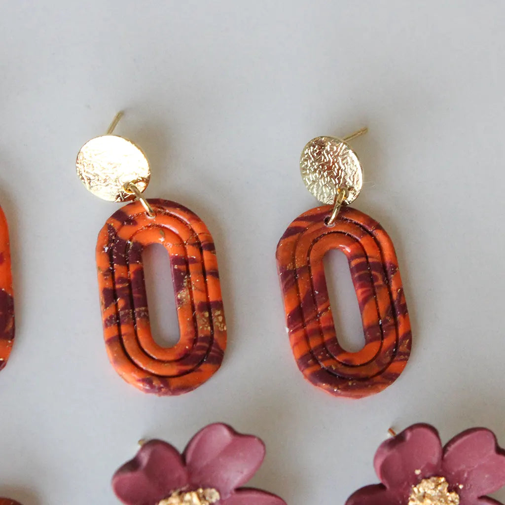 Aura líneas estampado naranja y morado