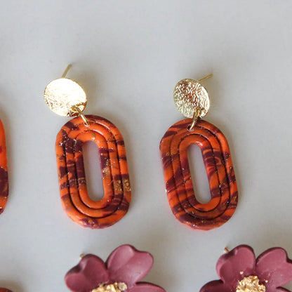 Aura líneas estampado naranja y morado