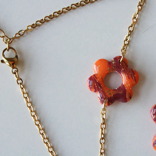 Pulsera flor estampado naranja y morado